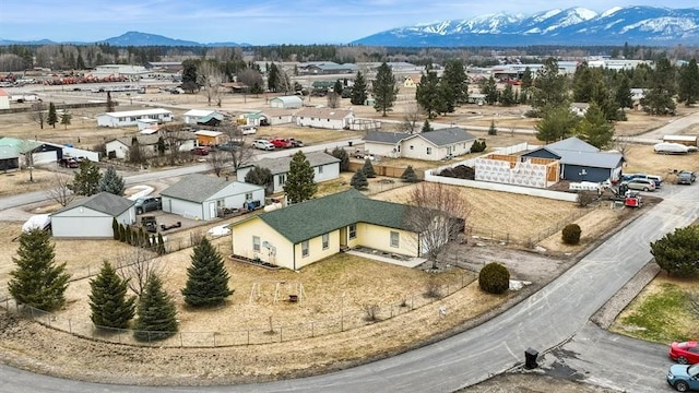 birds eye view of property featuring a mountain view