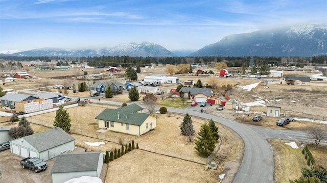 birds eye view of property featuring a mountain view