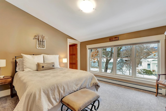 carpeted bedroom featuring a baseboard radiator and vaulted ceiling