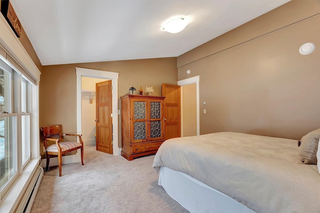 carpeted bedroom with a baseboard radiator and lofted ceiling