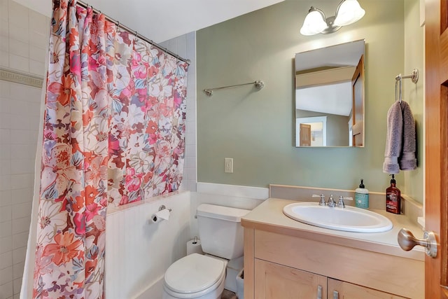 bathroom with vanity, toilet, and walk in shower