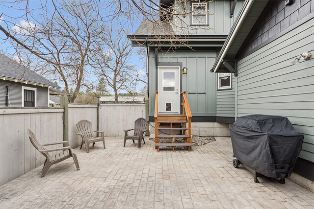 snow covered property entrance with a porch