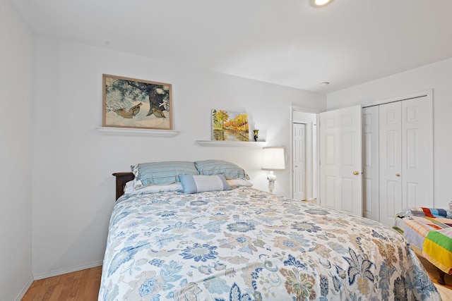 bedroom with hardwood / wood-style flooring