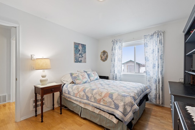 bedroom with light hardwood / wood-style floors