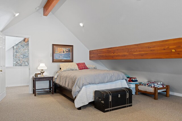 carpeted bedroom featuring lofted ceiling with beams