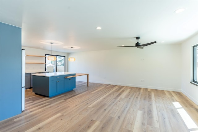 230 Fox Farm Dr, Whitefish, MT 59937 - unfurnished living room featuring recessed lighting, a ceiling fan, and light wood-style flooring