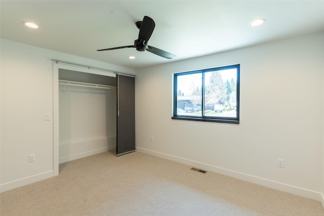 230 Fox Farm Dr, Whitefish, MT 59937 - unfurnished bedroom with recessed lighting, a closet, light carpet, and a ceiling fan