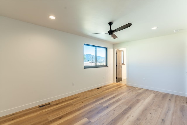 230 Fox Farm Dr, Whitefish, MT 59937 - unfurnished room with a ceiling fan, light wood-style flooring, recessed lighting, and a smoke detector