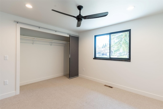 230 Fox Farm Dr, Whitefish, MT 59937 - unfurnished bedroom with light colored carpet, a closet, recessed lighting, and a ceiling fan
