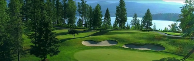 230 Fox Farm Dr, Whitefish, MT 59937 - view of home's community featuring view of golf course, a water view, an area to practice putting, and a yard