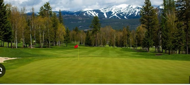 230 Fox Farm Dr, Whitefish, MT 59937 - view of home's community featuring a mountain view, view of golf course, and an area to practice putting