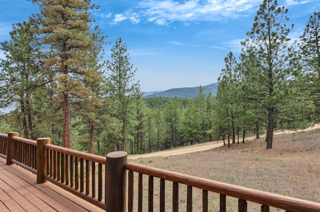 2122 Lightning Draw Trl, Victor, MT 59875 - wooden terrace with a mountain view and a view of trees