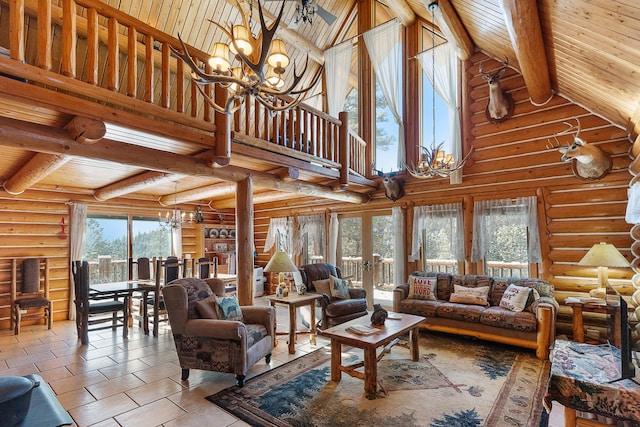 2122 Lightning Draw Trl, Victor, MT 59875 - living room featuring a chandelier, wood ceiling with exposed beams, log walls, tile patterned flooring, and high vaulted ceiling