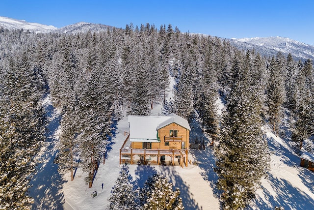 snowy aerial view with a mountain view