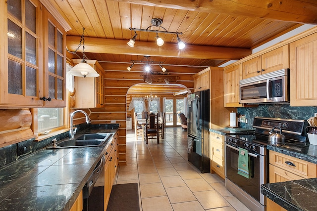 2122 Lightning Draw Trl, Victor, MT 59875 - kitchen with black appliances, a sink, wood ceiling with exposed beams, backsplash, and light tile patterned floors