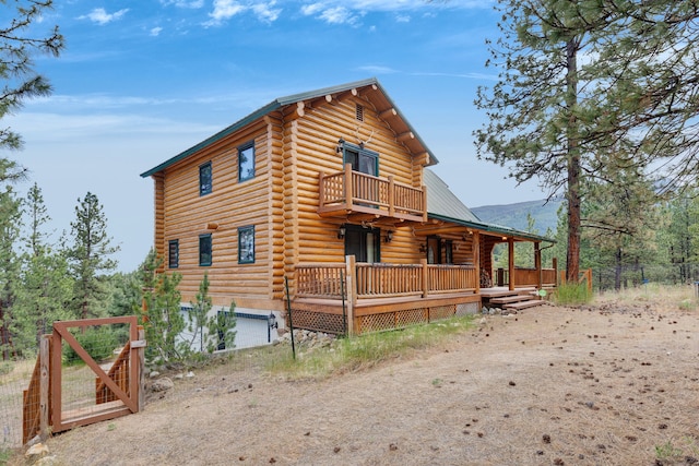 2122 Lightning Draw Trl, Victor, MT 59875 - view of home's exterior featuring log siding and metal roof