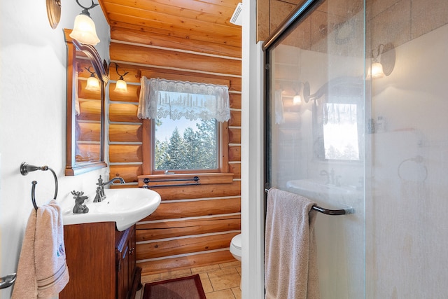 2122 Lightning Draw Trl, Victor, MT 59875 - bathroom with rustic walls, vanity, toilet, a shower stall, and wooden ceiling