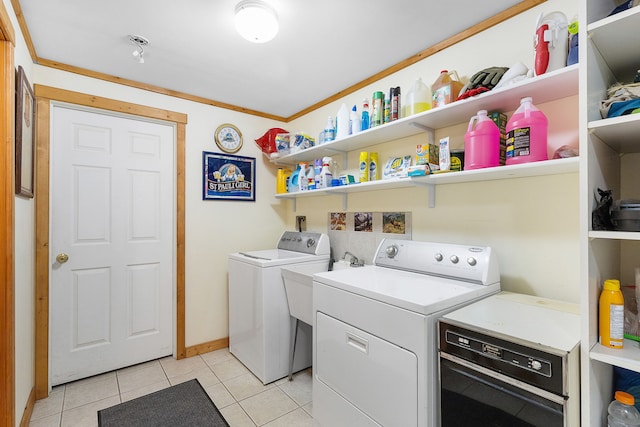 2122 Lightning Draw Trl, Victor, MT 59875 - washroom with washer and clothes dryer, light tile patterned flooring, baseboards, and ornamental molding