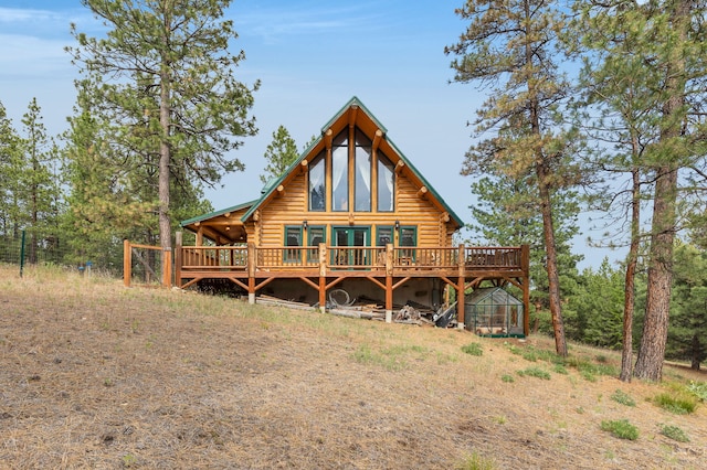 2122 Lightning Draw Trl, Victor, MT 59875 - rear view of house featuring log siding and a wooden deck