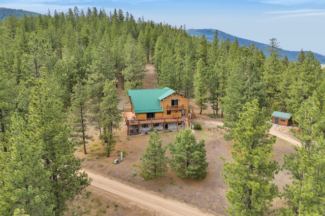 2122 Lightning Draw Trl, Victor, MT 59875 - view of subject property featuring a mountainous background and a forest