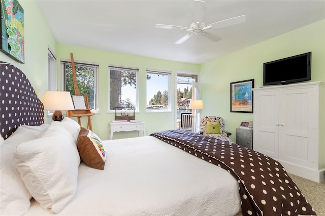 bedroom with multiple windows, carpet floors, a closet, and ceiling fan