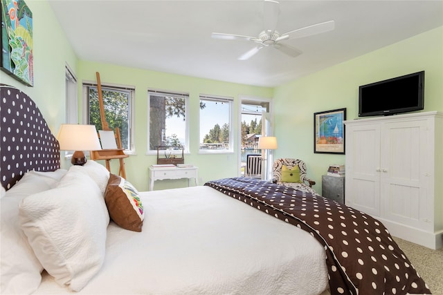 33191 Lakeshore Dr, Bigfork, MT 59911 - carpeted bedroom with multiple windows and ceiling fan