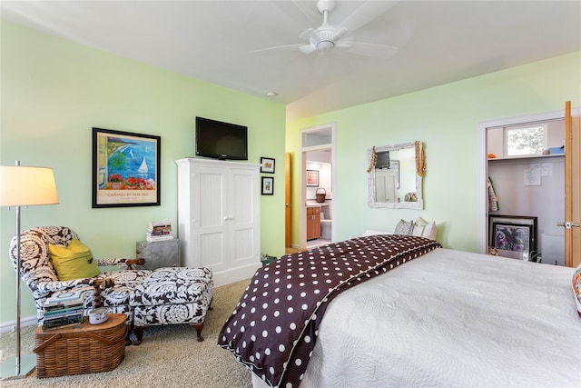 bedroom with ceiling fan, carpet, and ensuite bath