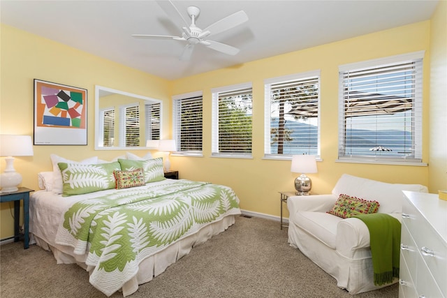 33191 Lakeshore Dr, Bigfork, MT 59911 - bedroom featuring carpet, multiple windows, and a ceiling fan