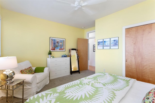 bedroom with a closet, ceiling fan, and light carpet