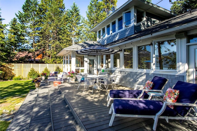 33191 Lakeshore Dr, Bigfork, MT 59911 - wooden terrace with outdoor dining area