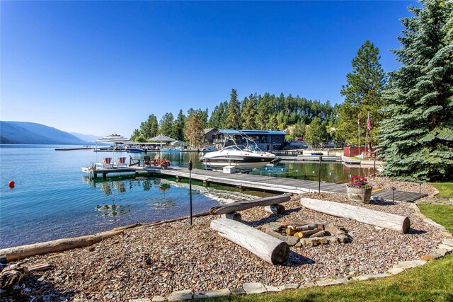 33191 Lakeshore Dr, Bigfork, MT 59911 - dock area with a water and mountain view and boat lift