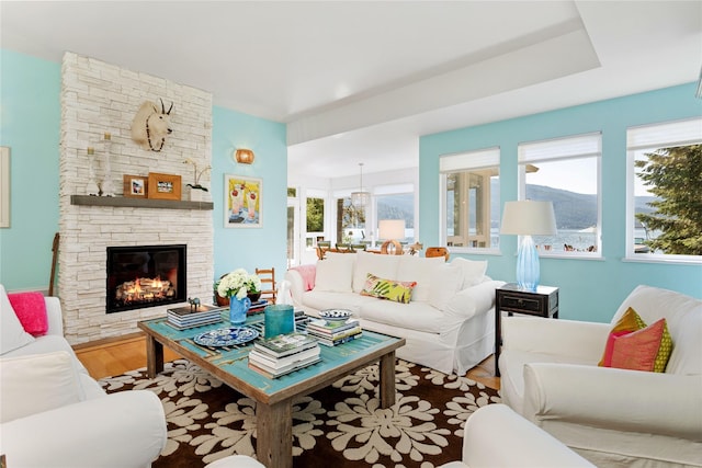 33191 Lakeshore Dr, Bigfork, MT 59911 - living area with wood finished floors and a fireplace
