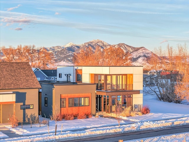 exterior space with a mountain view and a balcony