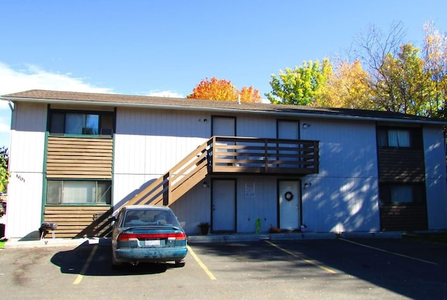 rear view of house featuring a balcony