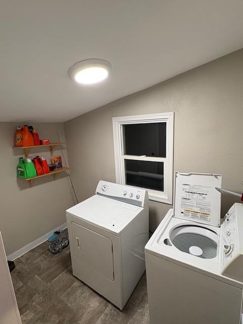 clothes washing area featuring washing machine and clothes dryer