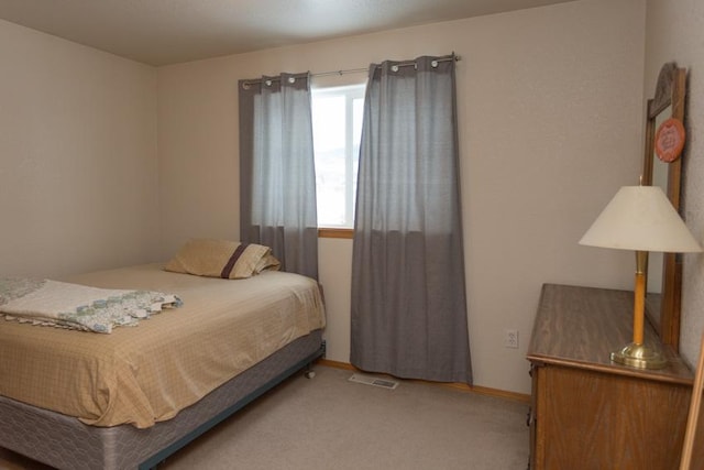 bedroom with light carpet