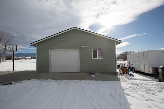 view of snow covered garage