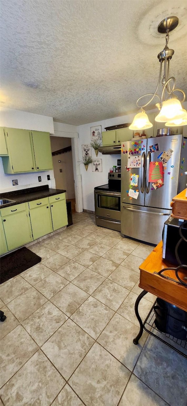 kitchen featuring a textured ceiling, stainless steel appliances, sink, hanging light fixtures, and green cabinetry