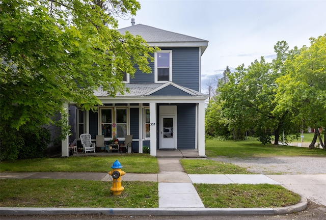 333 N 2nd St W, Missoula, MT 59802 - american foursquare style home with a porch, a front yard, and roof with shingles