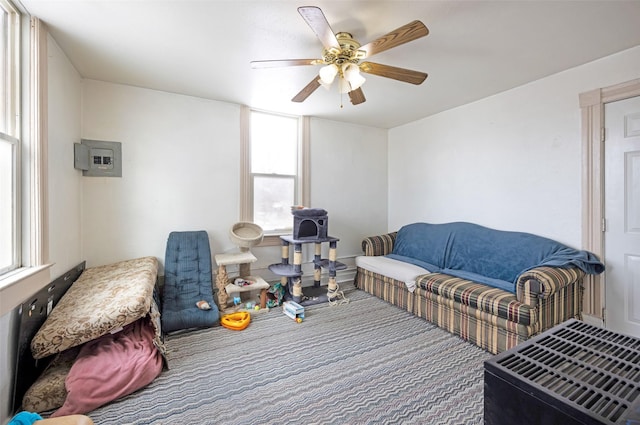 carpeted living room featuring ceiling fan