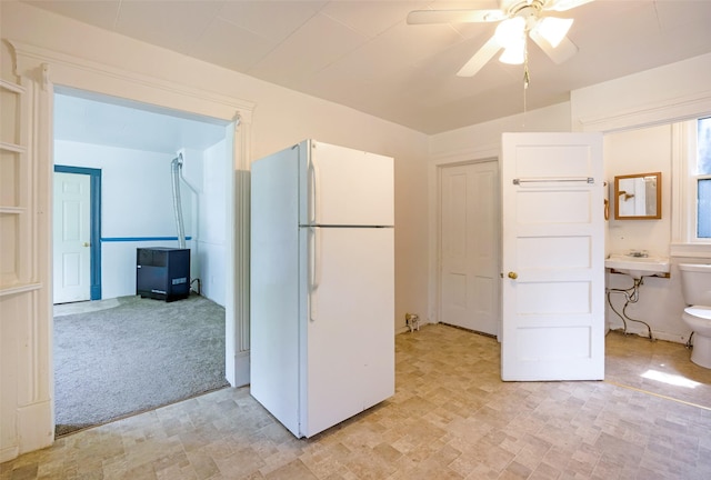 333 N 2nd St W, Missoula, MT 59802 - kitchen with freestanding refrigerator, a ceiling fan, a sink, and light carpet