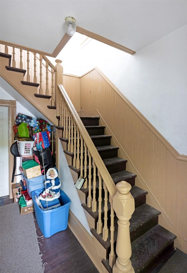 333 N 2nd St W, Missoula, MT 59802 - stairway featuring wainscoting, wood finished floors, and wooden walls