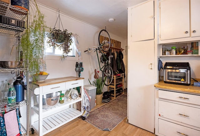 333 N 2nd St W, Missoula, MT 59802 - kitchen featuring light wood finished floors and white cabinets