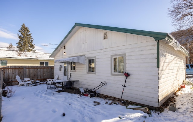 view of snow covered house