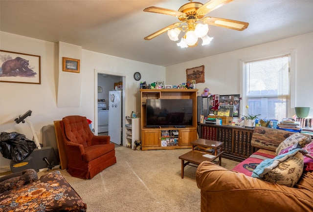 carpeted living room featuring ceiling fan