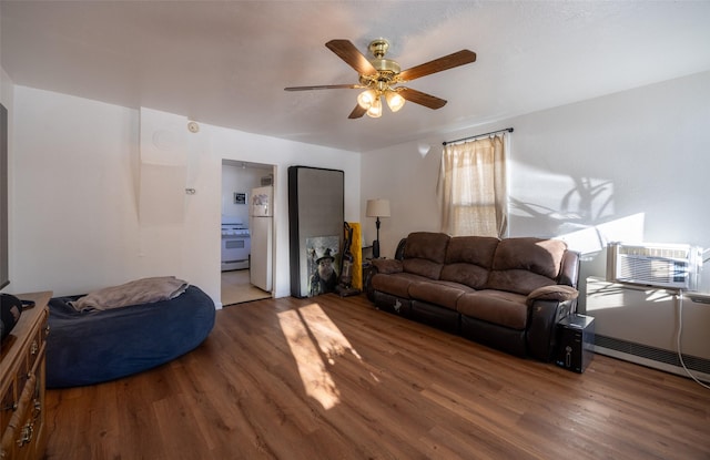 living room featuring hardwood / wood-style flooring and ceiling fan