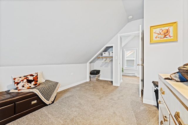 bonus room featuring lofted ceiling, a baseboard heating unit, and light carpet