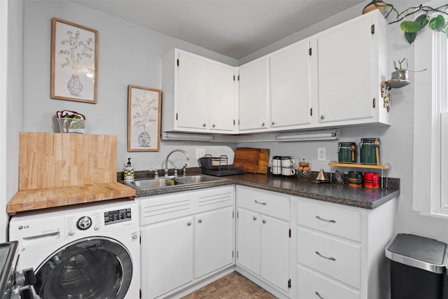 laundry area featuring cabinets and sink