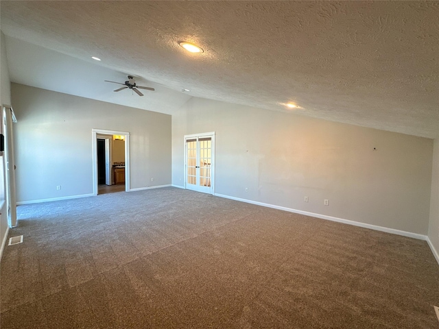 spare room featuring ceiling fan, french doors, a textured ceiling, carpet floors, and high vaulted ceiling