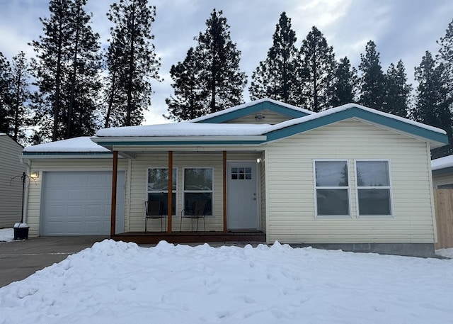 view of front of home featuring a garage and covered porch